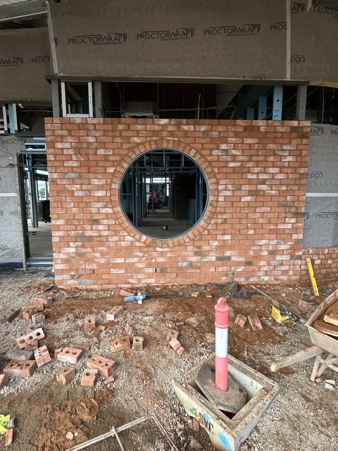 Circular brick opening with decorative brick arch