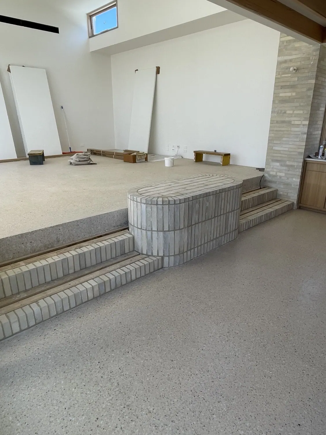 Curved brick steps and feature wall